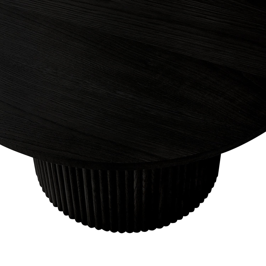 Table basse sur pied contemporaine effet bois noir avec base cylindrique fine pour le salon