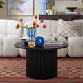 Table basse contemporaine effet bois noir avec base cylindrique à panneaux pour salon